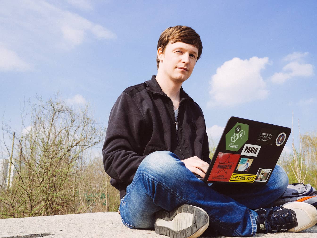 Some guy with a laptop sitting outdoors for no reason